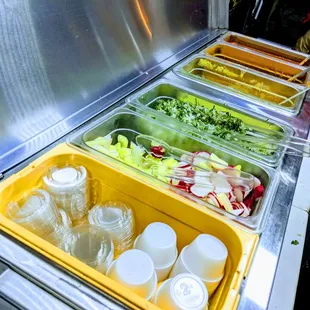 Sauces! Cucumber and radish slices. Onion and cilantro mix.