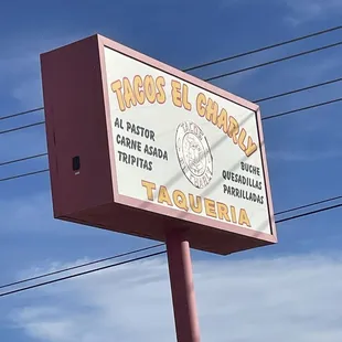 a sign for tacos el charly