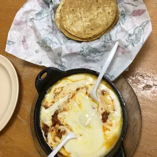a pan of food with a spoon in it
