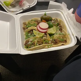 The 5 Crane Asada Tacos with limes and radish and jalapeños