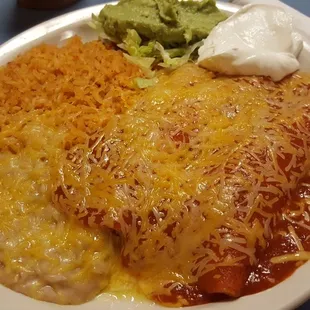 Cheese is enchiladas, rice and beans.