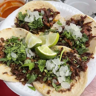 two chorizo and two al pastor tacos.