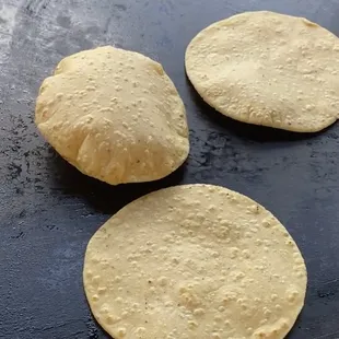 three uncooked tortillas
