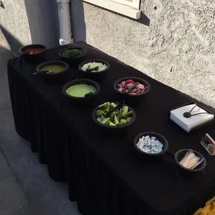 Our condiment table with a basic setup .