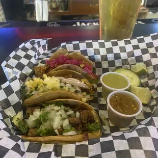 Al pastor (center) carne asada (bottom), special taco (top - can&apos;t remember name lol but delish!) and cold beer! 6 tacos for $17.