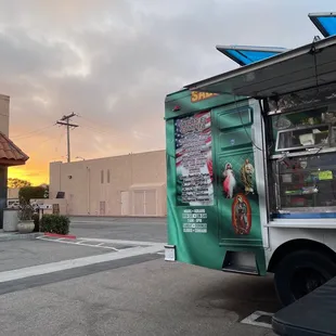 a taco truck parked in a parking lot