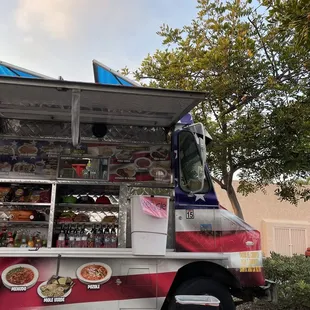 a taco truck parked in a parking lot