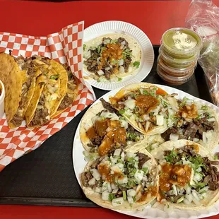 QuesaBirria Tacos on the left - Asada Tacos on the right