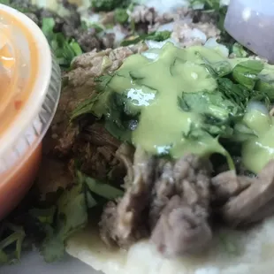 a plate of tacos with sauce