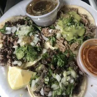 a plate of tacos and salsa