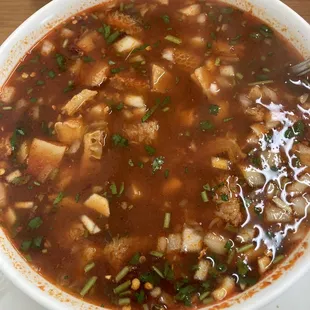 Menudo with cilantro, onion &amp; crushed pepper