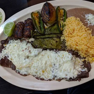 "Tradicional de Durango" Skirt Steak With Cheese, Chorizo, Cactus, Guacamole, Grilled Jalapeños and Onion ThatsDelishIsh.com