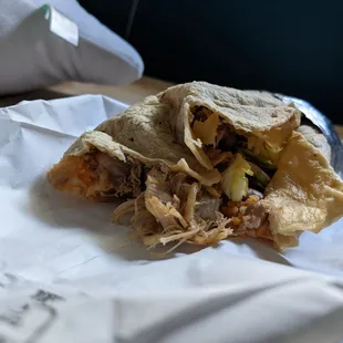 a burrito with meat and vegetables