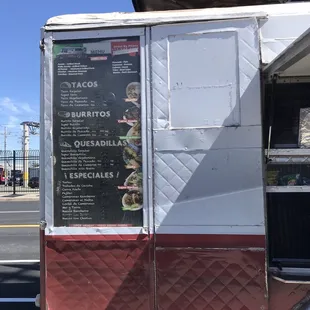 a food truck with menus