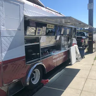 a food truck parked on the side of the road