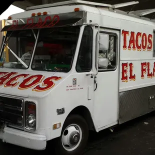 a taco truck parked in a parking lot