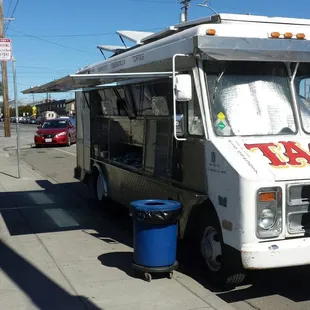 a taco truck parked on the side of the road