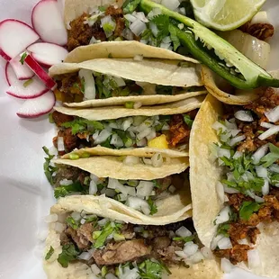 Tripa and pastor tacos
