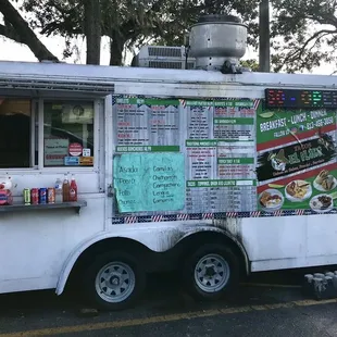 Food truck with menu on side.