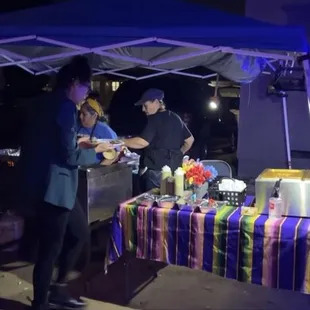 man serving food to a woman