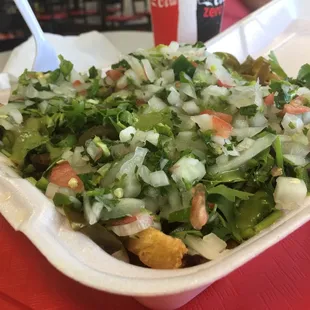 Carne asada fries topped with onions, jalapeños , cilantro, and green salsa ...bomb!!!!