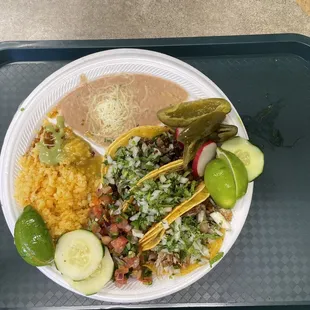 Street tacos rice and beans with fixings from the salsa bar