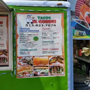 Menu board. All entrees are $12 with one meat, price goes up for multiple. Nachos are $9