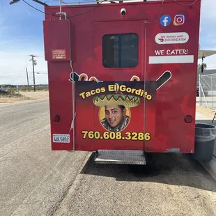 a tacos el gordito truck parked on the side of the road