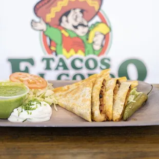 Quesadilla (choice of meat) on the side comes with lettuce, sour cream,  guacamole, tomato, and grilled onion and jalapeño