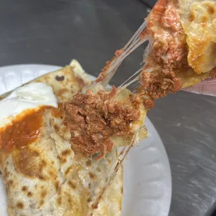 Al Pastor Quesadilla with sour cream and red salsa