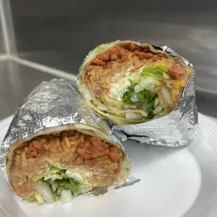 Super burrito filled with pastor, beans, rice, onion, cilantro, mixed Mexican cheese, lettuce and sour cream.