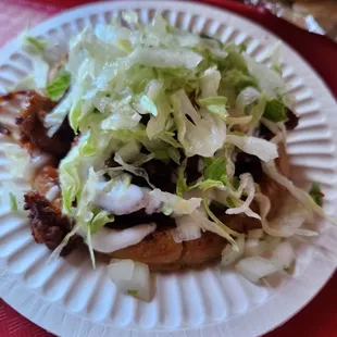 a taco on a paper plate