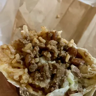 A few shreds of cheese, which i really had to search for, and no sour cream, its supposed to be a super burrito :/