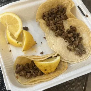 Plain asada tacos they gave me more lemons then carne .