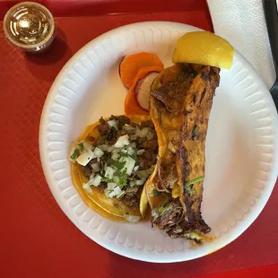 Asada taco and queso taco with birria