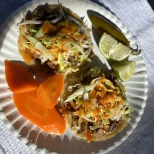 tortilla crispy, with the cheese melted on top of the tortilla (bomb) then asada, more cheese, lettuce, salsa