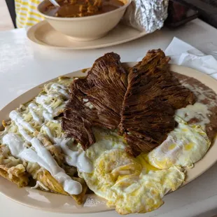 Chilaquilas with glorious carne from the gourmet meat market next door.