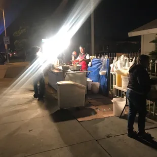 a group of people preparing food