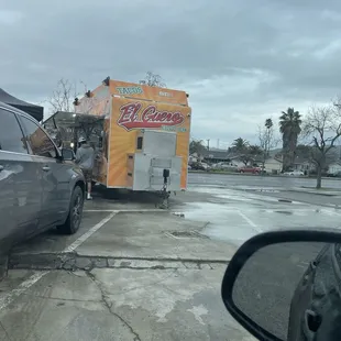 a taco truck parked in a parking lot