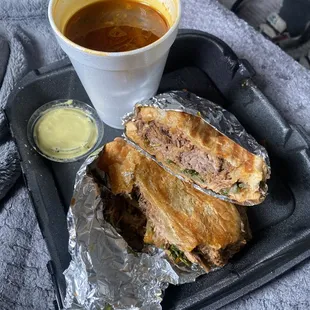 Torta titanic with birria, it tastes nice, but doesn't look like the picture they have at the counter.