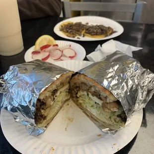 Asada torta and two tacos.