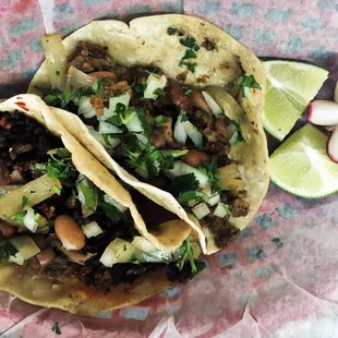 Taco de Tripa (tripe...not for the weak hearted) y Taco de Campechano (various meat combo this one was beef and chorizo sausage).