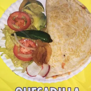 quesadilla on a paper plate