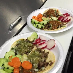 two plates of food on a counter