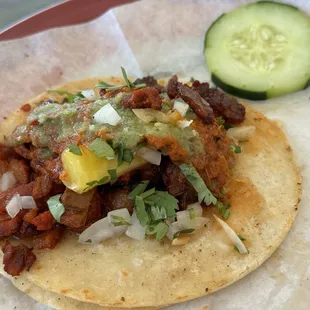 Taco al pastor.  I had three, but the one is all I could take a photo of because they were too good to wait!