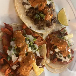 Al pastor Tacos and carne asada taco (top)