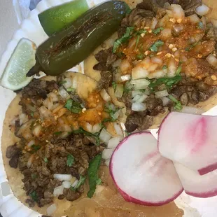 Asada tacos with extra hot sauce