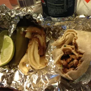 Regular burrito with side of grilled onions, pickled jalapeño, and fresh lime.