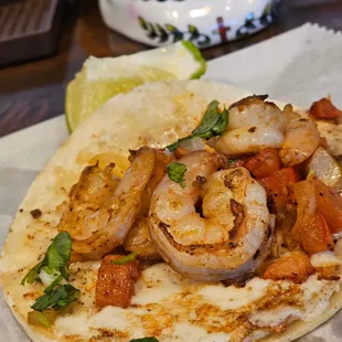 a shrimp taco on a tortilla