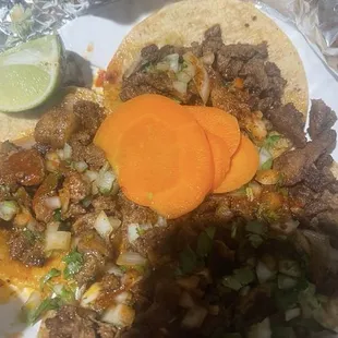 For Al Pastor tacos to go cilantro onions and sauce  all Thiers sauces are delicious